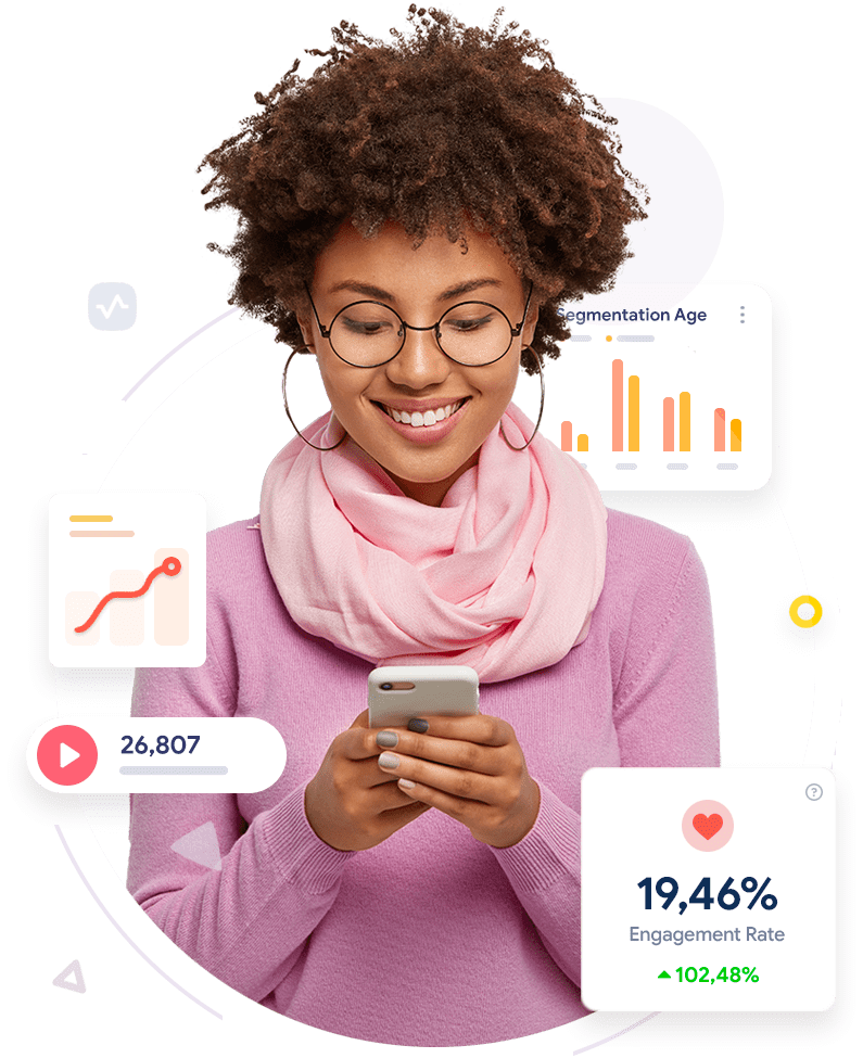 a girl using her phone and smiling